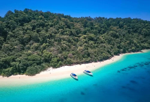 Aerial view of Koh Rok showing twin islands, white sandy beaches, turquoise waters, and vibrant coral reefs