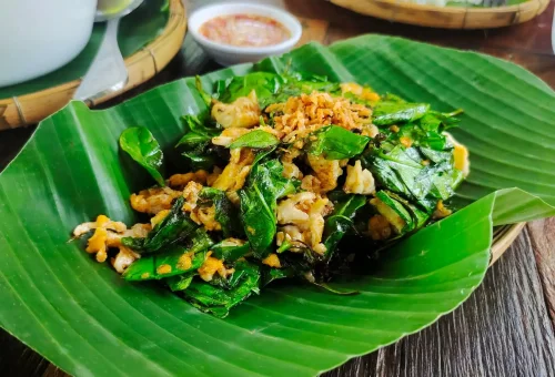 Freshly prepared Thai dishes served on traditional plates during a cooking class at Old Phuket Farm