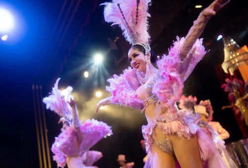 Simon Cabaret Phuket stage scene featuring performers in luxurious costumes, set against a vibrant and decorative backdrop.