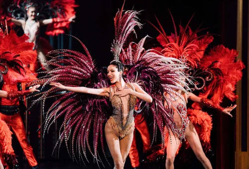 Simon Cabaret Phuket performers in a dramatic group pose wearing sparkling costumes and theatrical makeup.