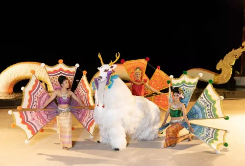 Enchanting stage performance at Siam Niramit Phuket featuring celestial beings in traditional Thai costumes and mystical scenery.