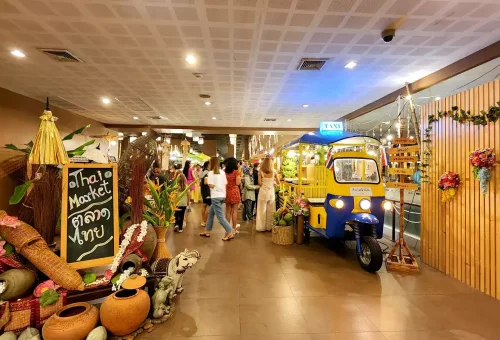 Elaborate stage performance at Siam Niramit Phuket with traditional Thai costumes, golden lighting, and cultural storytelling.