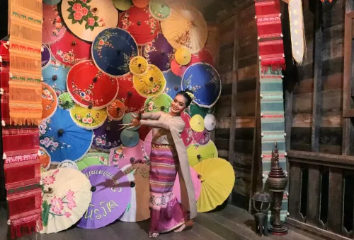 Cultural Thai stage performance at Siam Niramit Phuket with dancers in traditional costumes under vivid stage lights.