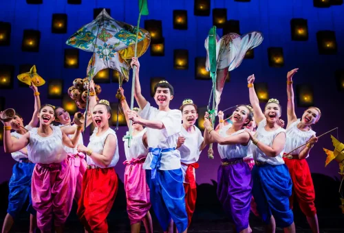 Elephant performers in ceremonial costumes during a live stage act at Phuket FantaSea Show