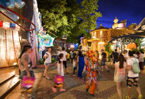 Ornate golden interior of the dining hall with Thai architectural details at Phuket FantaSea