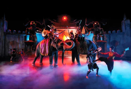 Colorful stage with performers and traditional Thai decor at Phuket FantaSea Show