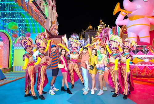 Fantasy-themed illuminated sculptures and glowing decor in a nighttime garden at Carnival Magic Phuket