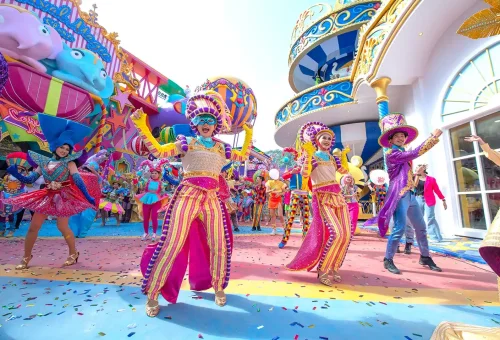 Stunning night view of a glowing walkway lined with lights and decorations at Carnival Magic Phuket