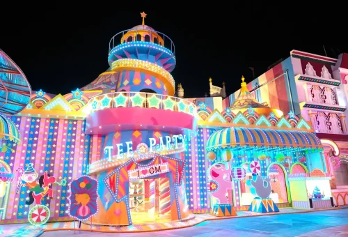 Visitors admiring sparkling light sculptures and colorful displays at Carnival Magic Phuket