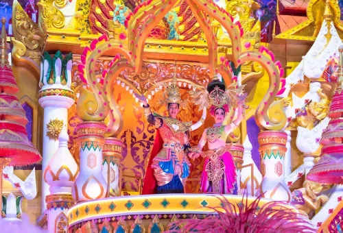 Guests walking through a glowing fantasy-themed light tunnel at Carnival Magic Phuket