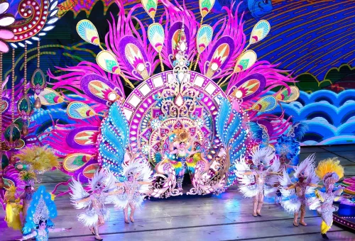 Carnival Magic Phuket entrance lit up with vibrant lights and colorful decorations at night