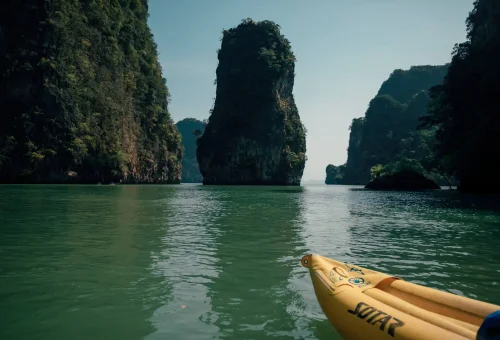 Evening canoe tour through a sea cave with soft glowing lights at Hong Island by Starlight