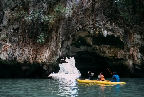 Stunning view of sea caves illuminated by soft light during the Hong Island by Starlight tour