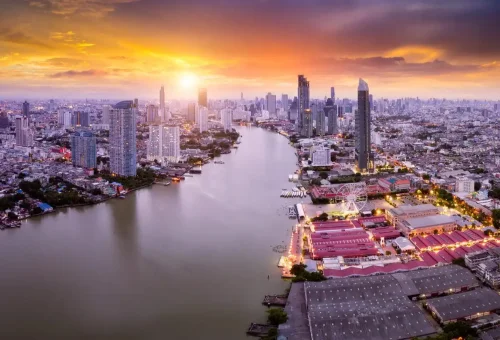 Bangkok Skyline Sunset – Cityscape glowing with golden hues and modern skyscrapers.