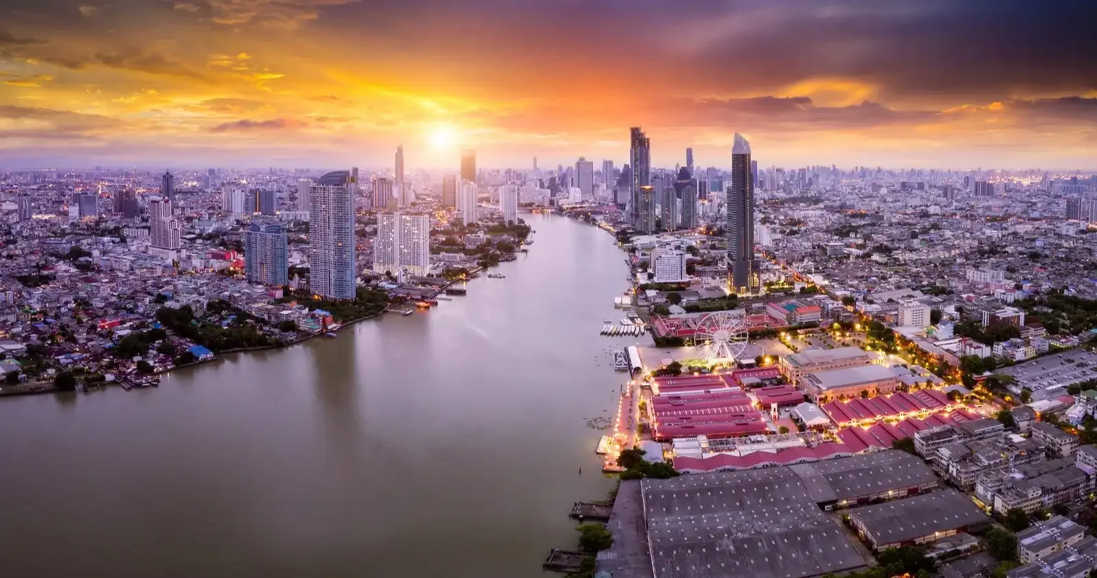 Bangkok Skyline Sunset – Cityscape glowing with golden hues and modern skyscrapers.