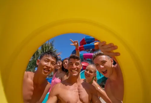 Children and adults enjoying colorful water slides and wave pools at Andamanda Phuket Waterpark, a top-rated family attraction.