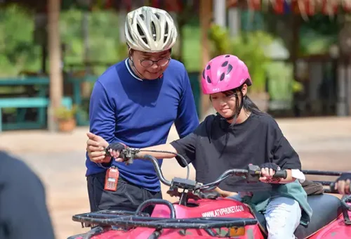 ATV instructor guiding a rider at Phuket ATV Adventure, offered by Phuket Travel Store