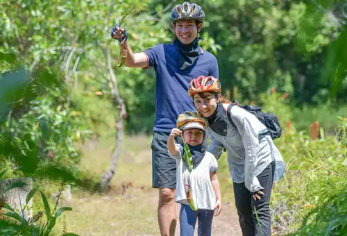 Family preparing for an ATV ride at Phuket ATV Adventure, provided by Phuket Travel Store