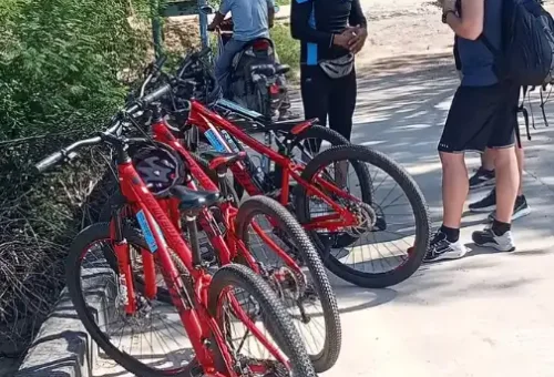 Cycling guide giving safety instructions and route briefing to the group on Koh Yao Noi, part of the Phuket Travel Store cycling tour