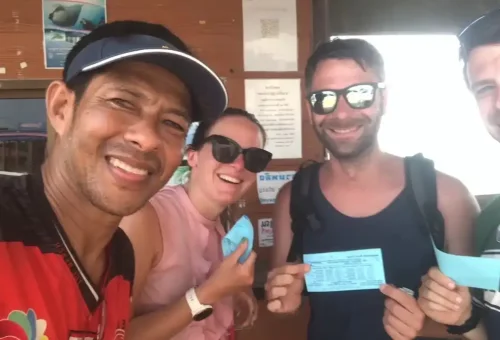 Smiling customer posing with biking guide during the Koh Yao Noi cycling tour, organized by Phuket Travel Store
