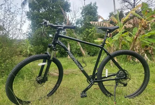 A row of mountain bikes parked on a scenic trail at Koh Yao Noi, ready for a cycling adventure through the island’s lush countryside and coastal roads.