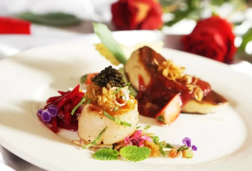 An elegant display of colorful Thai dishes prepared by students at Blue Elephant Cooking School Phuket, arranged beautifully on traditional plates.