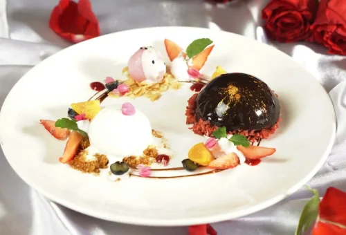 Close-up of beautifully garnished Thai dishes prepared by students at Blue Elephant Cooking School Phuket, showcasing their cooking success.