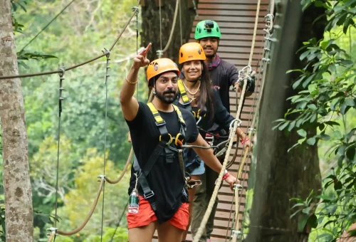 Family and couple enjoying a fun-filled zipline ride together at Flying Hanuman in Phuket, with jungle views all around