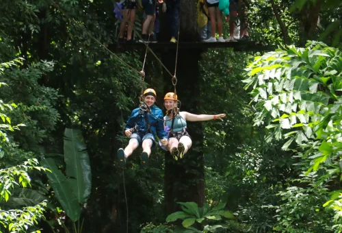 Family and couple enjoying a scenic and exciting zipline ride through Phuket’s tropical rainforest at Flying Hanuman