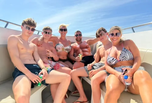 Happy customer enjoying a speedboat ride to Raya Island with Phuket Travel Store – clear skies and turquoise water.