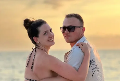 Romantic couple enjoying a serene sunset cruise near Coral Island and Promthep Cape.