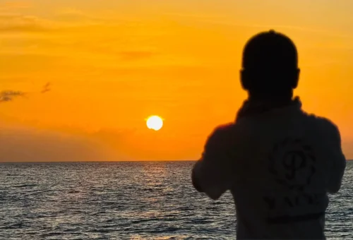 Breathtaking sunset view from a sailing yacht cruise near Coral Island and Promthep Cape.