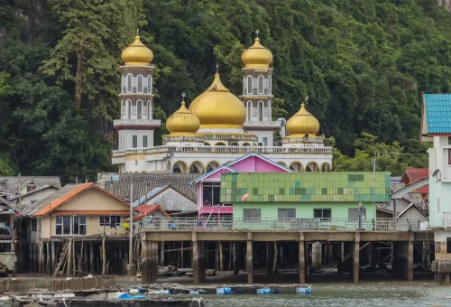 Beautiful mosque at Koh Panyee floating village, standing above the water with a mountainous backdrop – PhuketTravelStore.com
