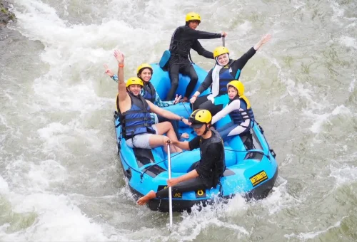 Rafting team navigating thrilling river currents in Phang Nga with Anda Adventure – tropical jungle backdrop – PhuketTravelStore.com