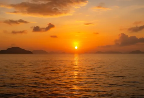 Sunrise over the calm Andaman Sea during the Sunrise 4 Island Tour from Phuket Travel Store