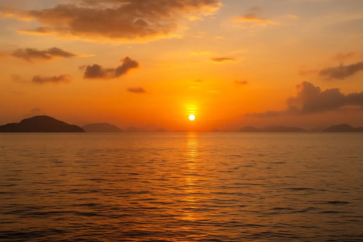 Sunrise over the calm Andaman Sea during the Sunrise 4 Island Tour from Phuket Travel Store