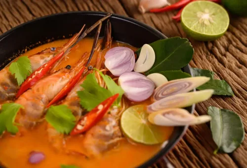 Tom Yum Goong soup from Kata Thai Cooking Class in Phuket – spicy and sour Thai shrimp soup with herbs and chili.