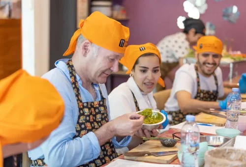 Customer tasting homemade Thai food at Kata Thai Cooking Class in Phuket