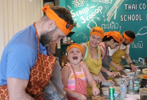 Child participating in Thai cooking activity at Kata Thai Cooking Class in Phuket