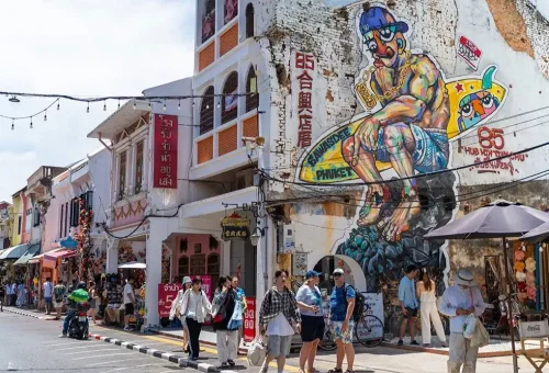 Charming row of colorful Sino-Portuguese buildings on Thalang Road in Phuket Town, captured during the street food tour with Phuket Travel Store