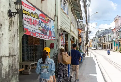 Heritage buildings and vintage signage along a quiet street in Old Town Takuapa, reflecting the area’s Thai-Chinese cultural influence.