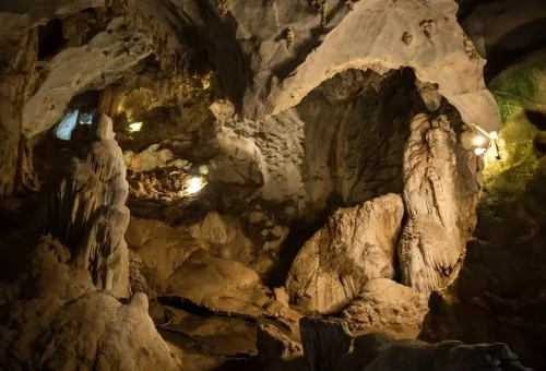 Guided canoe tour exploring limestone caves and tunnels at Panak Island in Phang Nga Bay, Thailand