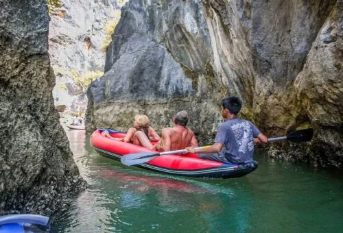 Canoeing at sunrise through limestone caves and lagoons at Hong Island in Phang Nga Bay, Thailand