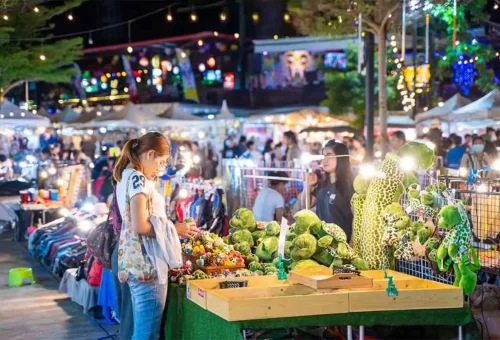Colorful night market stalls and crowds at Chillva and Naka Markets in Phuket Town, Thailand