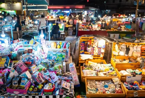 Lantern-lit vendor stalls at Naka Market Phuket with traditional Thai crafts
