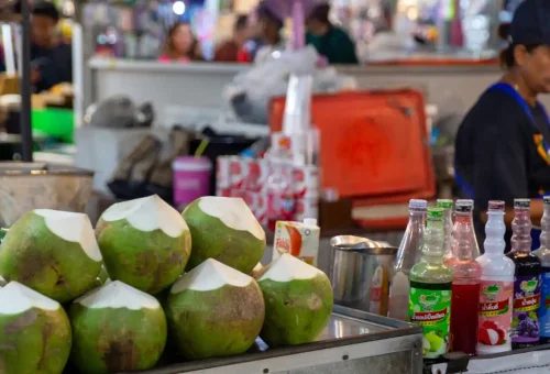 Night market vendor selling Thai street food at Naka Market, Phuket Town