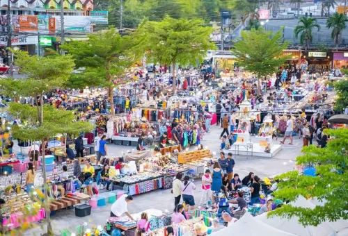 Colorful market lights at Chillva Night Market with food carts and music