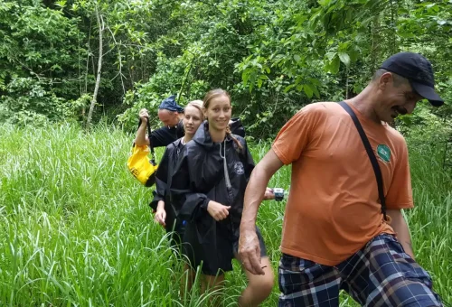 Hiker exploring lush jungle trails at Khao Sok National Park with Phuket Travel Store.