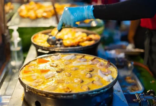 Colorful Sunday market at Thalang Road in Phuket Town with Phuket Travel Store – local vendors, souvenirs, and live music