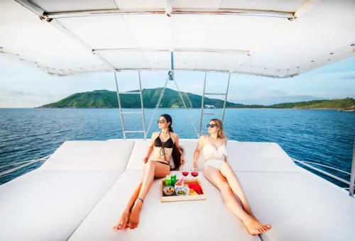 Traveler relaxing on the deck of the Elizabeth private sailing yacht in Phuket with Phuket Travel Store